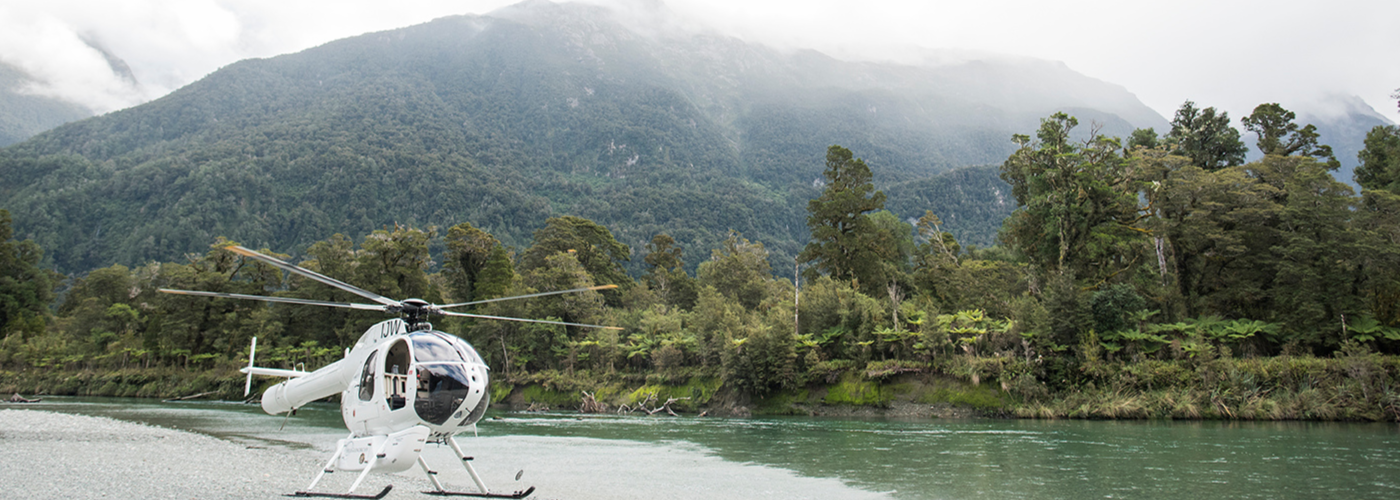 Heli taking off nearby water
