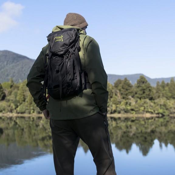 Man overlooking lake with reflections