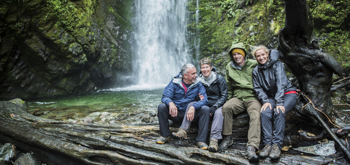 Group in front of waterfall
