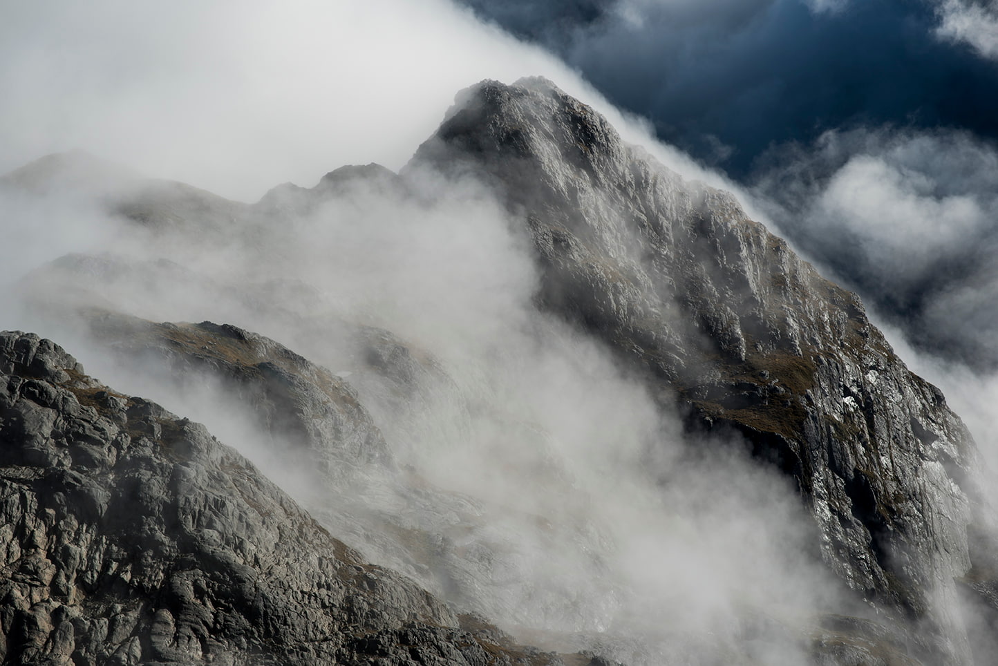 Mist rising from mountain top